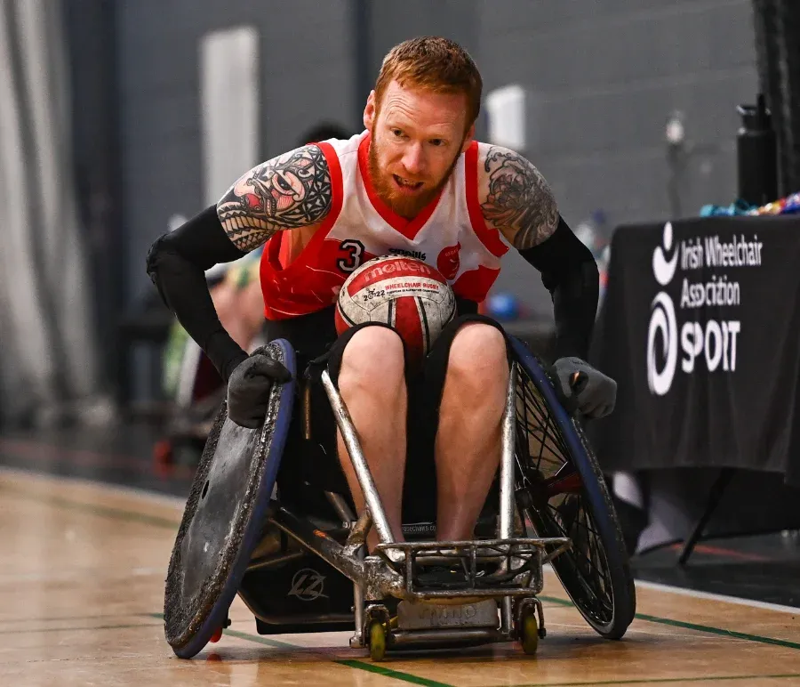 wheelchair rugby player in action on court